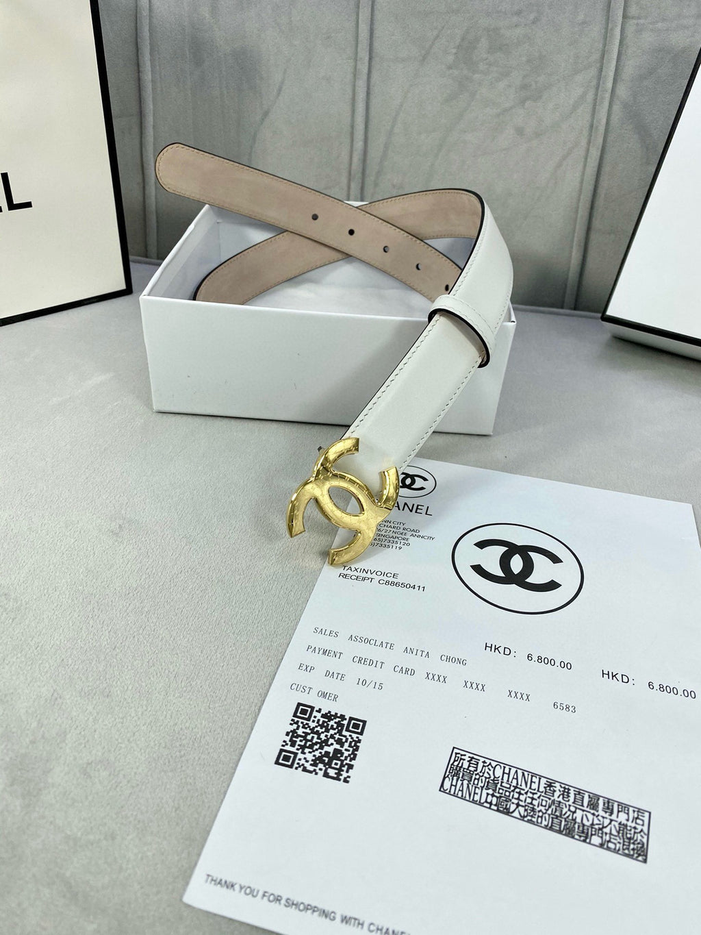 White leather belt with gold-tone CC buckle and belt keeper loops
