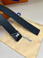 Textured dark blue belt straps with silver-tone buckle and LV emblem