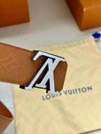 Cognac Louis Vuitton belt with monogram strap and oversized LV buckle