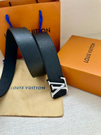 Louis Vuitton belt front view: dark navy embossed strap and oversized gold-tone LV buckle