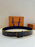 Louis Vuitton belt with monogram pattern, dark strap, and gold buckle detail