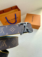 Louis Vuitton monogram belt close-up with metal buckle and yellow-trim edges