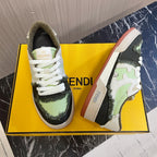 Fendi low-top sneakers, pair on yellow box, white laces, lime green/black, cream sole.
