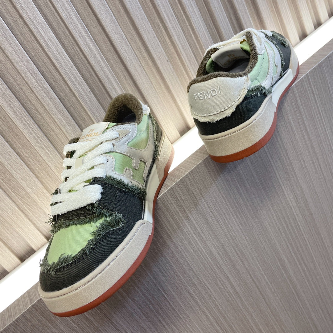 Fendi low-top sneakers, rear view, white laces and lime green/black upper, cream sole.
