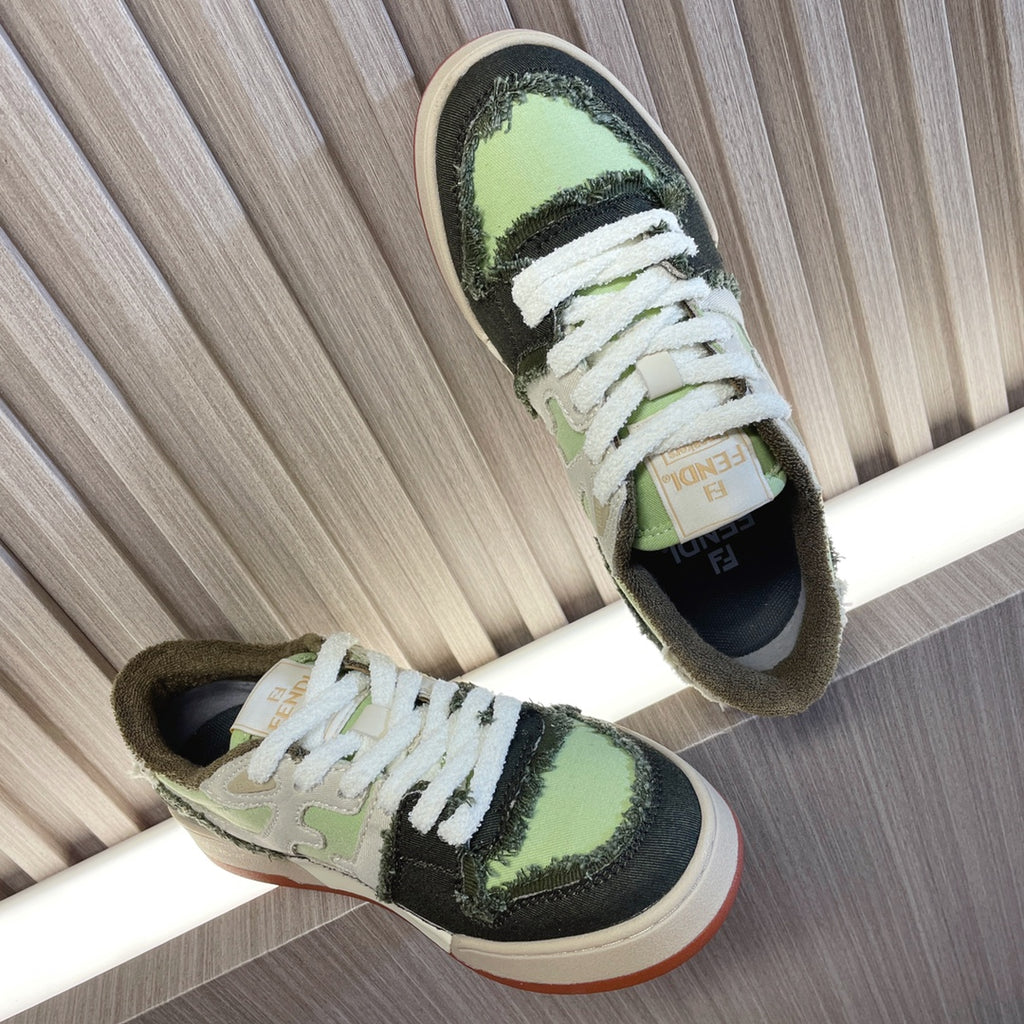 Fendi low-top sneakers with white laces, lime green top, black side stripe, cream sole.