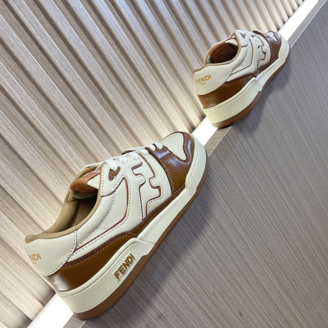 Unisex Fendi leather sneakers, angled view showing brown heel and white body