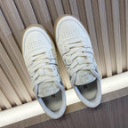 White leather lace-up sneakers with perforated toe and beige rubber sole, Fendi logo