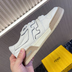 White low-top sneakers with side logo detailing and beige rubber sole, Fendi