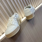 White lace-up sneakers with beige sole and Fendi back heel logo
