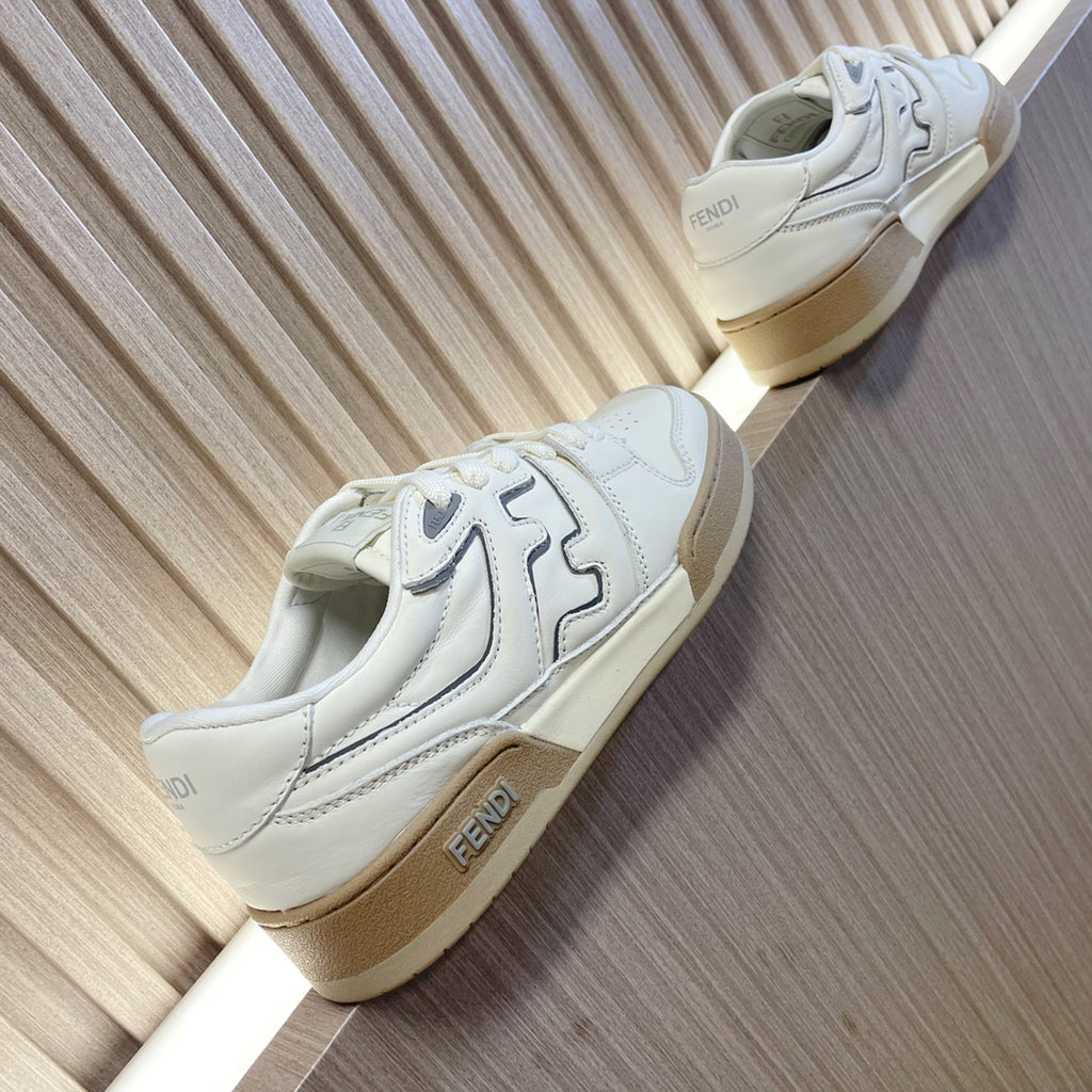 White lace-up sneakers with oversized side logo panels and beige sole, Fendi