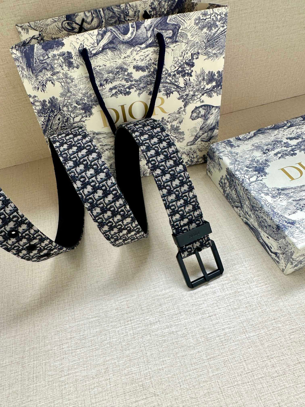 Louis Vuitton belt with blue monogram webbing and black pin buckle