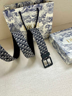 Louis Vuitton belt with blue monogram webbing and black pin buckle
