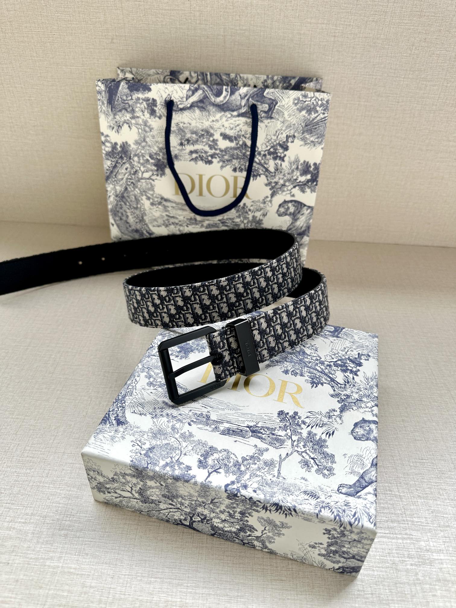 Louis Vuitton belt with blue monogram strap and black metal buckle