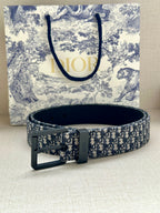 Louis Vuitton belt with blue monogram strap and large black pin buckle
