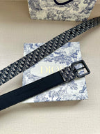 Louis Vuitton belt angled view with blue monogram strap and black rectangular buckle