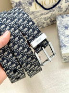 Dior belt buckle and strap close-up with repeating monogram pattern