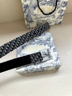Dior belt with navy patterned strap and silver buckle, shown at an angle
