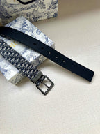 Dior belt with black leather tail and silver rectangular buckle over blue jacquard
