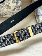 Navy Dior monogram belt strap with gold buckle and leather tab