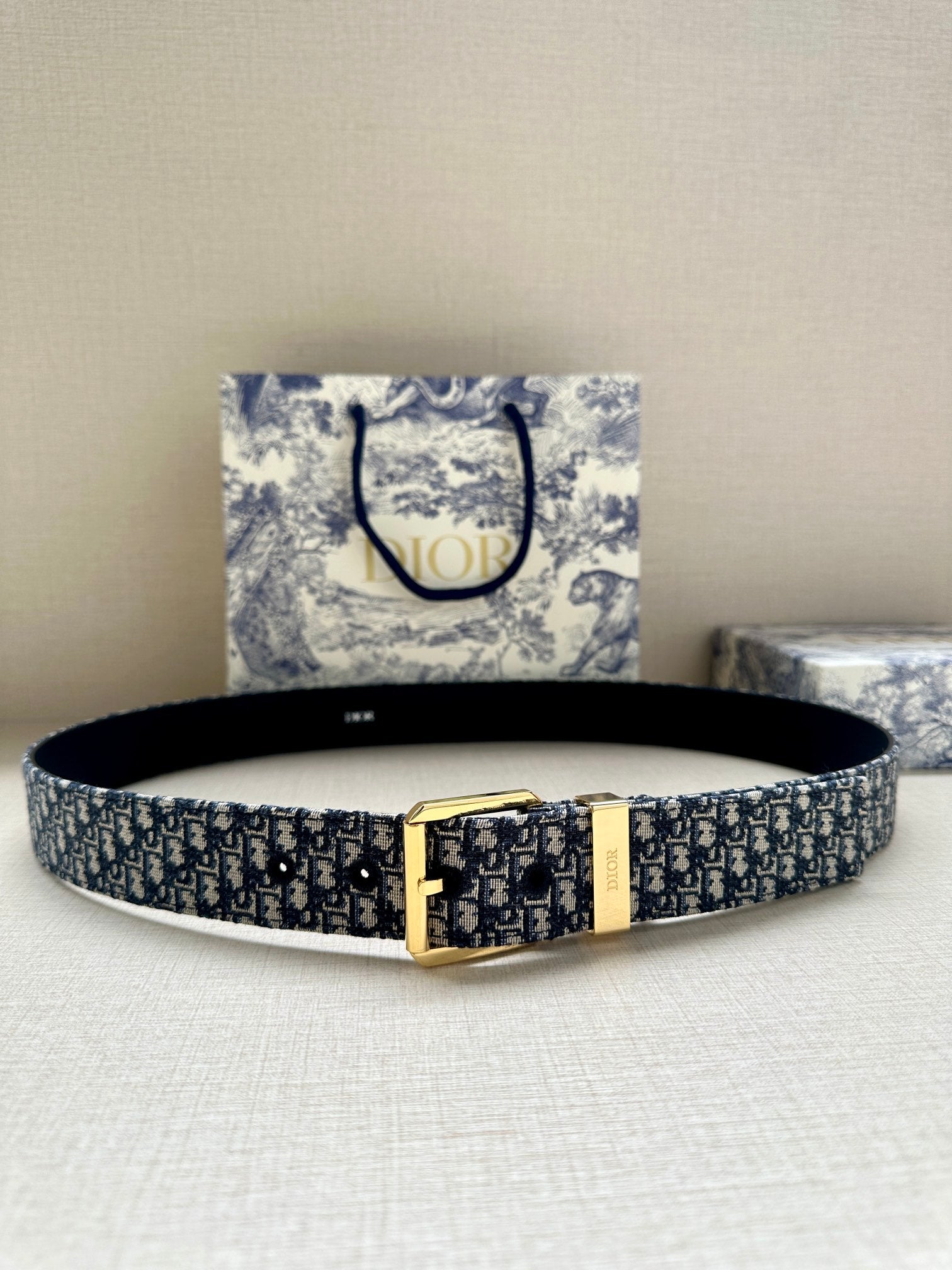 Navy Dior belt with Dior monogram webbing and gold rectangular buckle