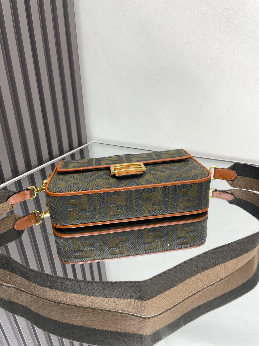 Fendi baguette bag top view with gold buckle clasp and FF logo canvas