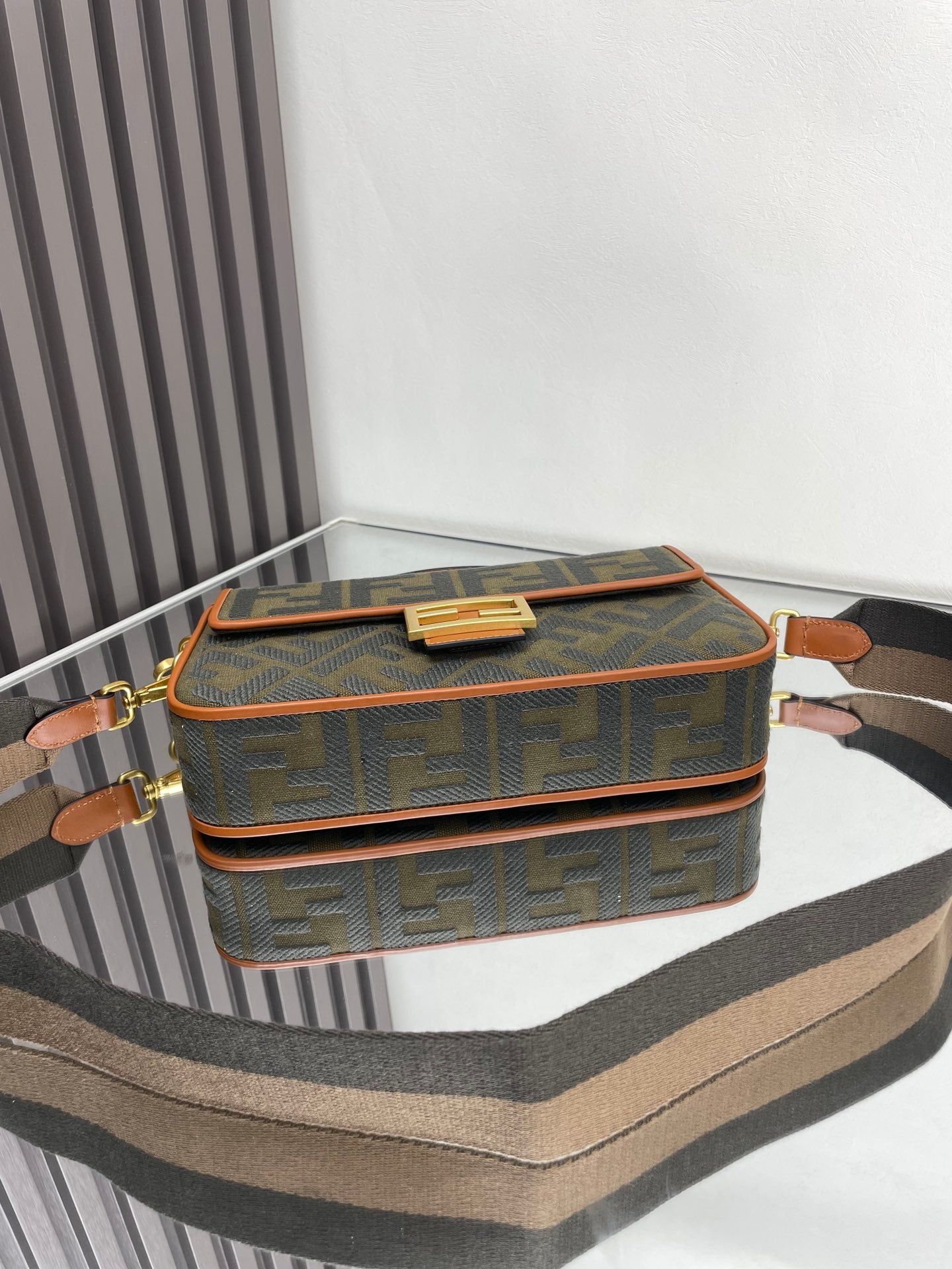 Fendi baguette bag top view with gold buckle clasp and FF logo canvas