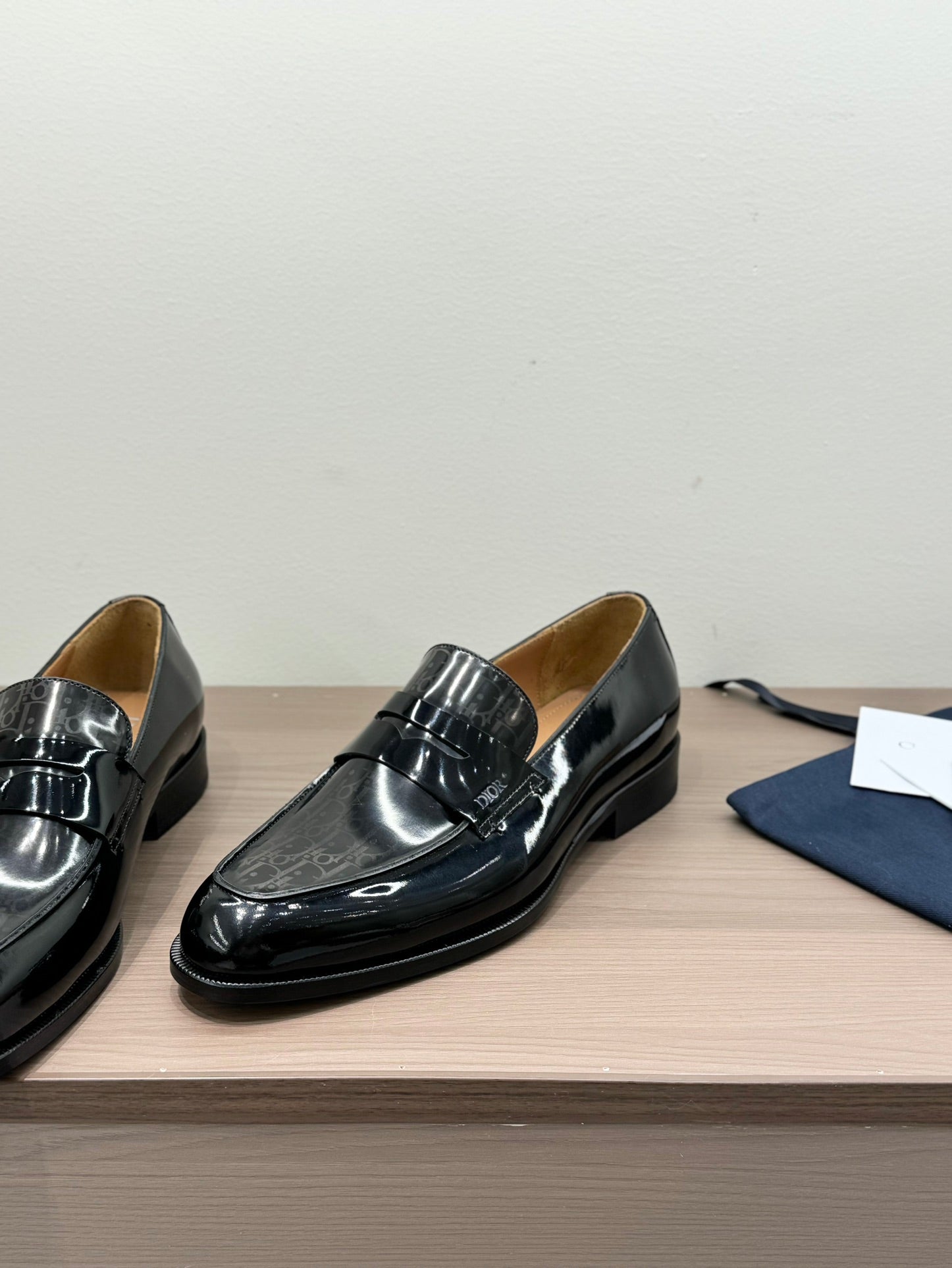 Unisex black patent loafers pair, square toe, buckle ornament