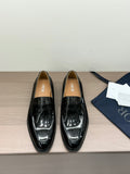 Unisex black patent loafers with front buckle detail, glossy finish