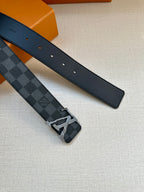 Louis Vuitton patterned leather belt with metal buckle and matching dark strap