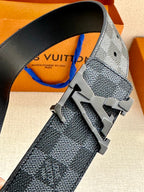 Louis Vuitton fabric belt close-up with metal buckle featuring LV logo
