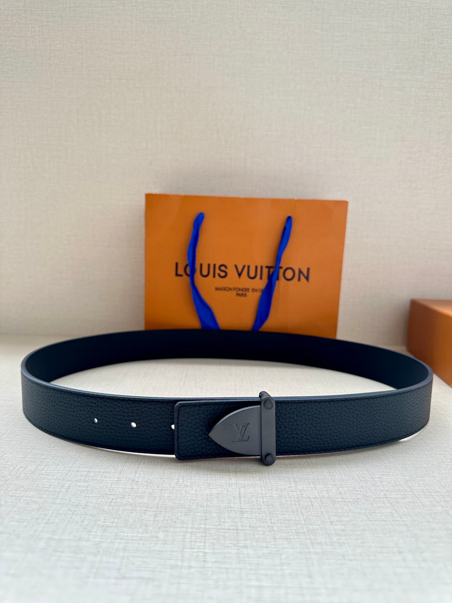 Louis Vuitton dark blue leather belt with silver buckle and embossed monogram plate
