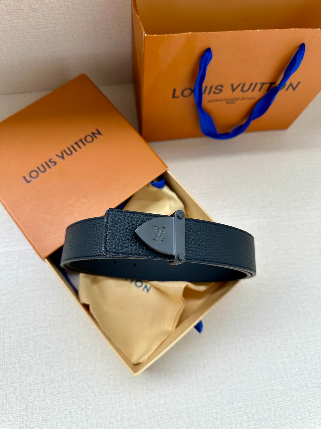 Louis Vuitton dark blue textured leather belt with silver buckle and LV engraving