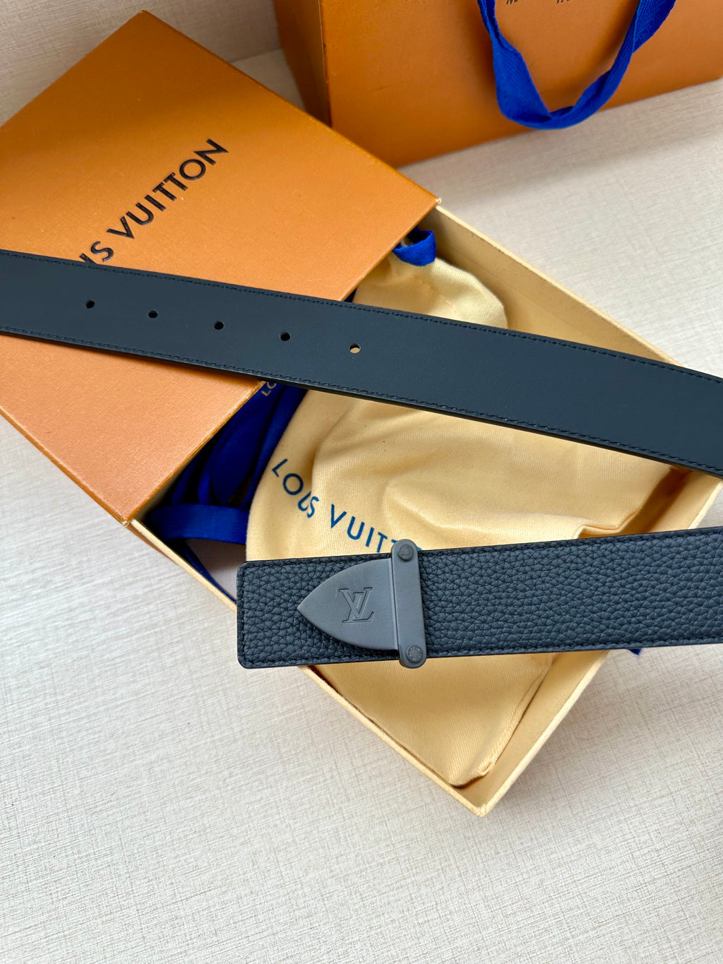 Louis Vuitton dark blue leather belt with silver buckle and punched adjustment holes
