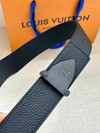 Louis Vuitton dark blue belt detail: textured leather strap and silver LV buckle