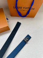 Blue leather belt with silver buckle and hanging blue leather tag