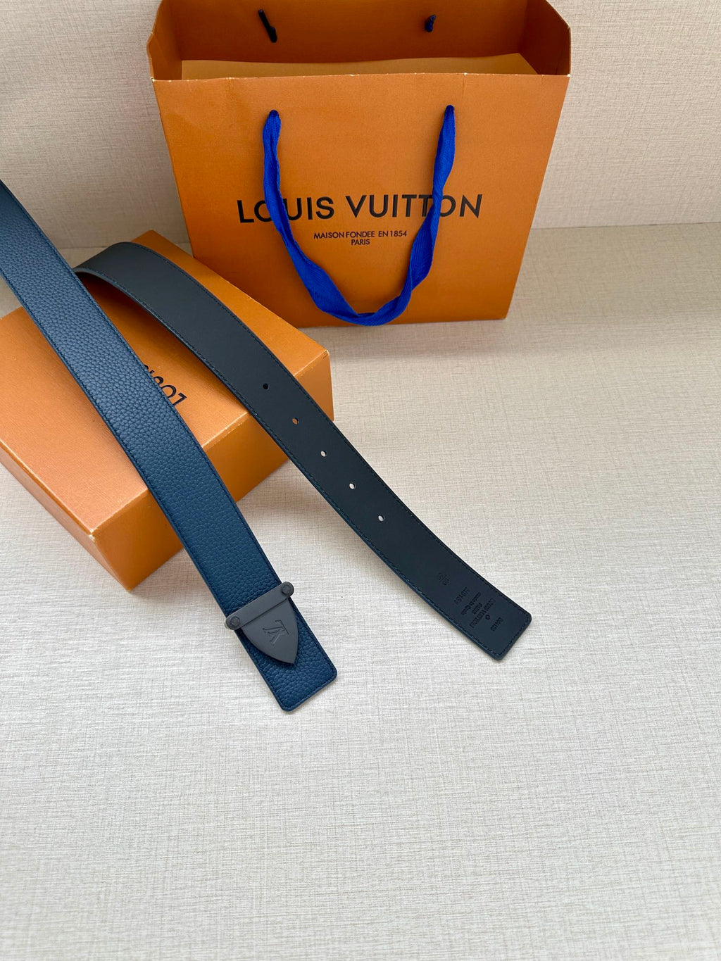 Louis Vuitton blue leather belt, two strap lengths with buckle end and holes