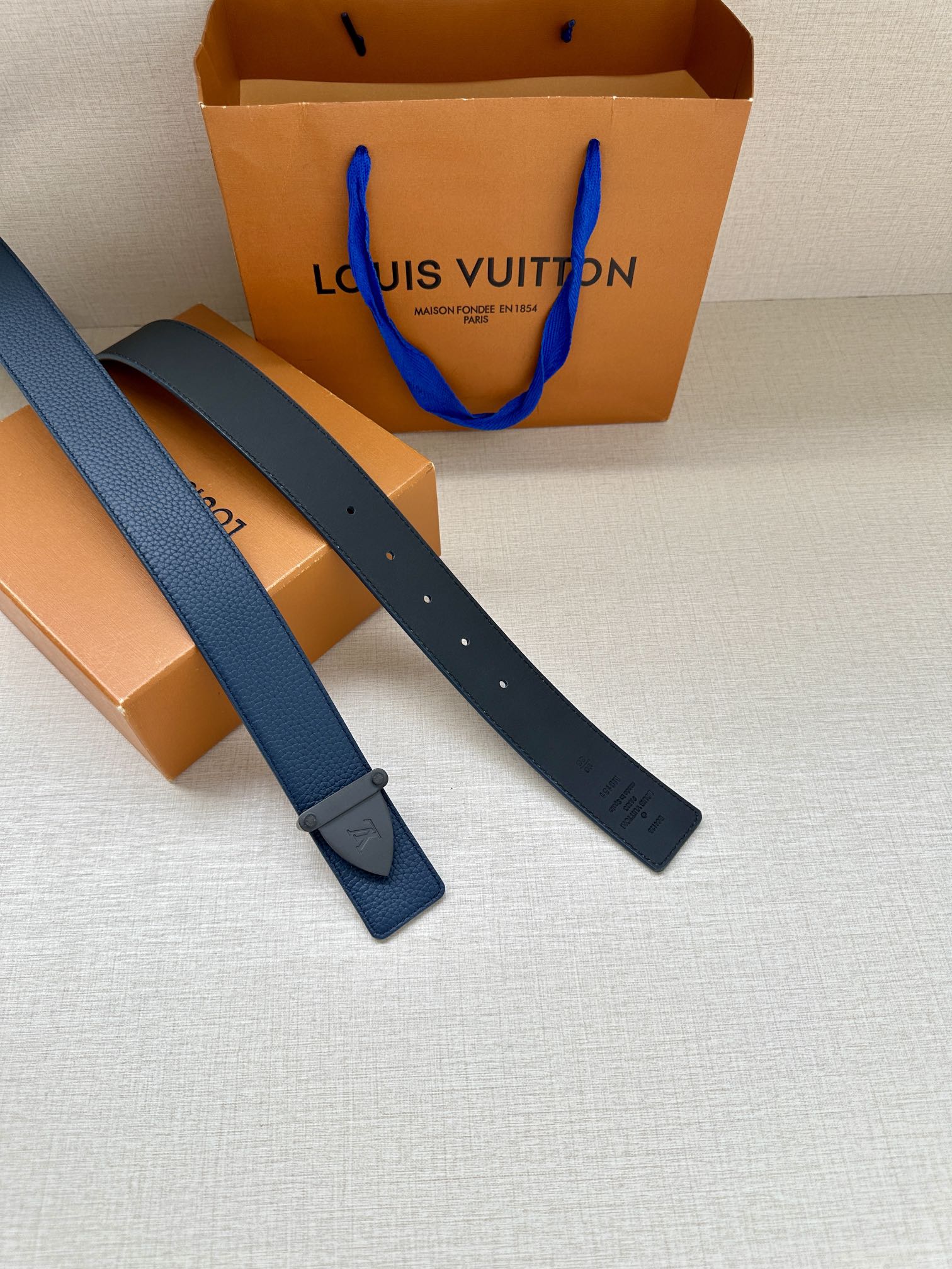 Louis Vuitton blue leather belt, two strap lengths with buckle end and holes
