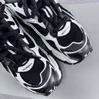 Balenciaga unisex sneaker pair on box, showing side panels and lace-up uppers