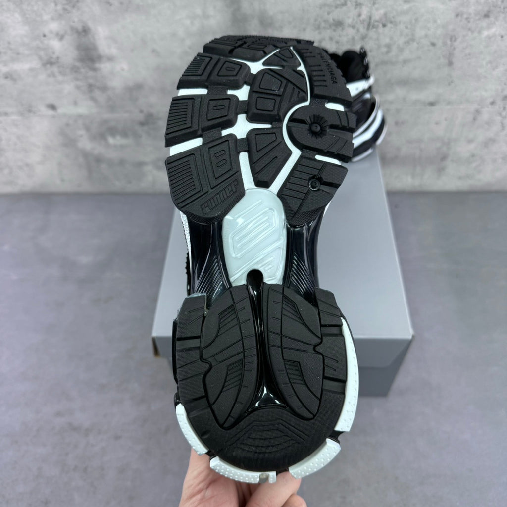 Balenciaga unisex sneaker outsole view with black traction tread and light trim