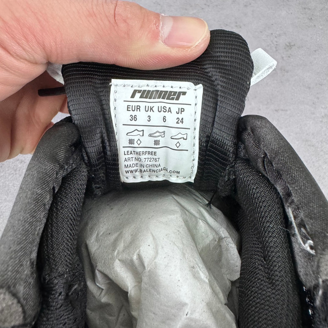 Balenciaga sneaker size label inside shoe showing EUR 36 and other listings