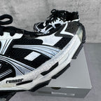 Balenciaga unisex sneaker close-up showing white overlays and black textured panels