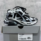 Balenciaga unisex sneaker, white and black, side view with lace-up closure