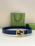 Gucci belt with navy leather strap and gold-tone GG buckle, with punched holes