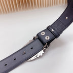 Leather belt strap with silver buckle hardware, grommets, and metal backing plate
