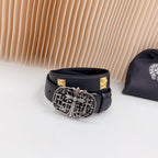 Leather belt with dark blue strap, gold square accents, and ornate silver buckle