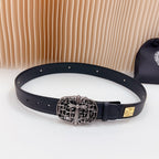 Leather belt with dark blue strap, ornate silver buckle, and gold accent squares