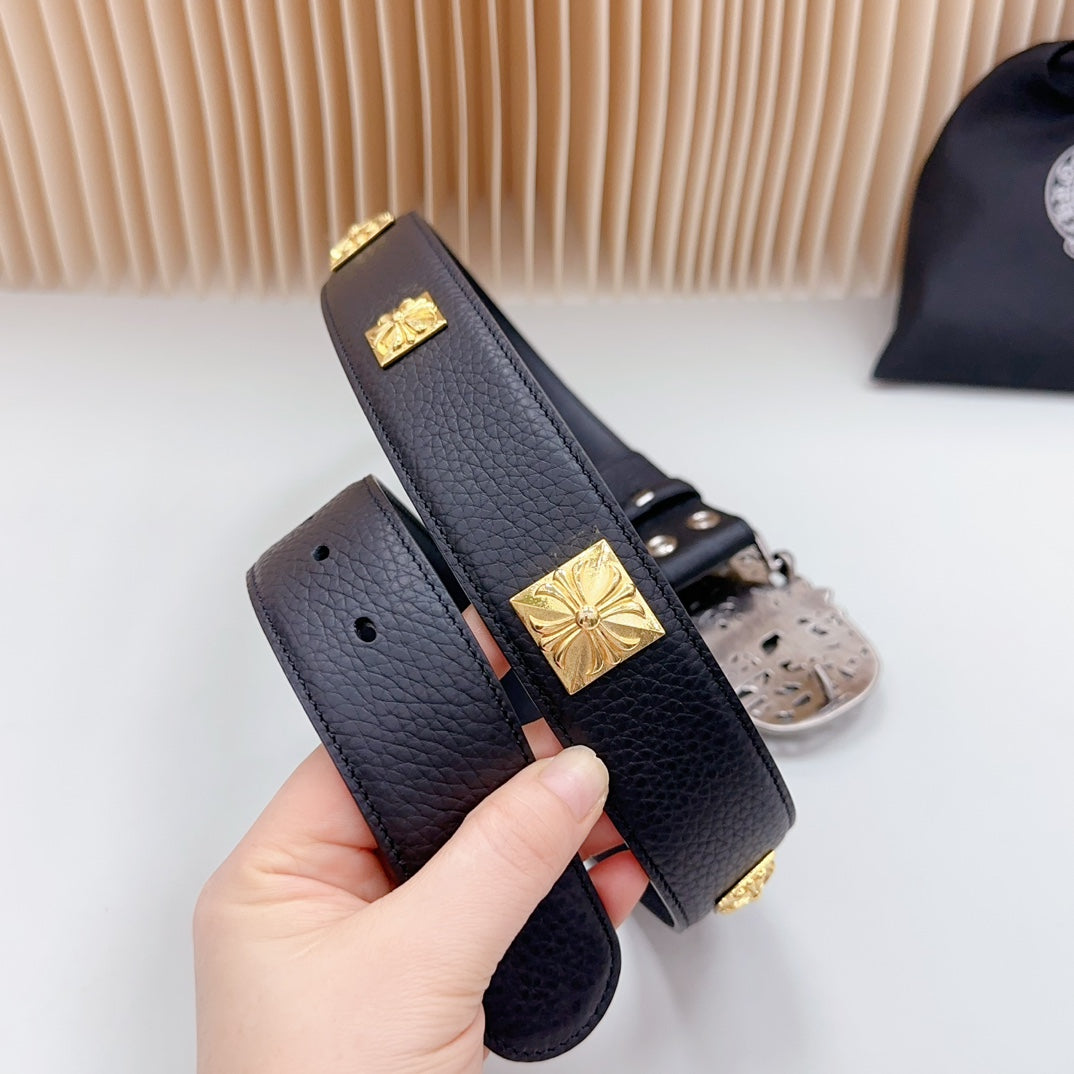 Leather belt end with gold square studs and dark blue textured strap