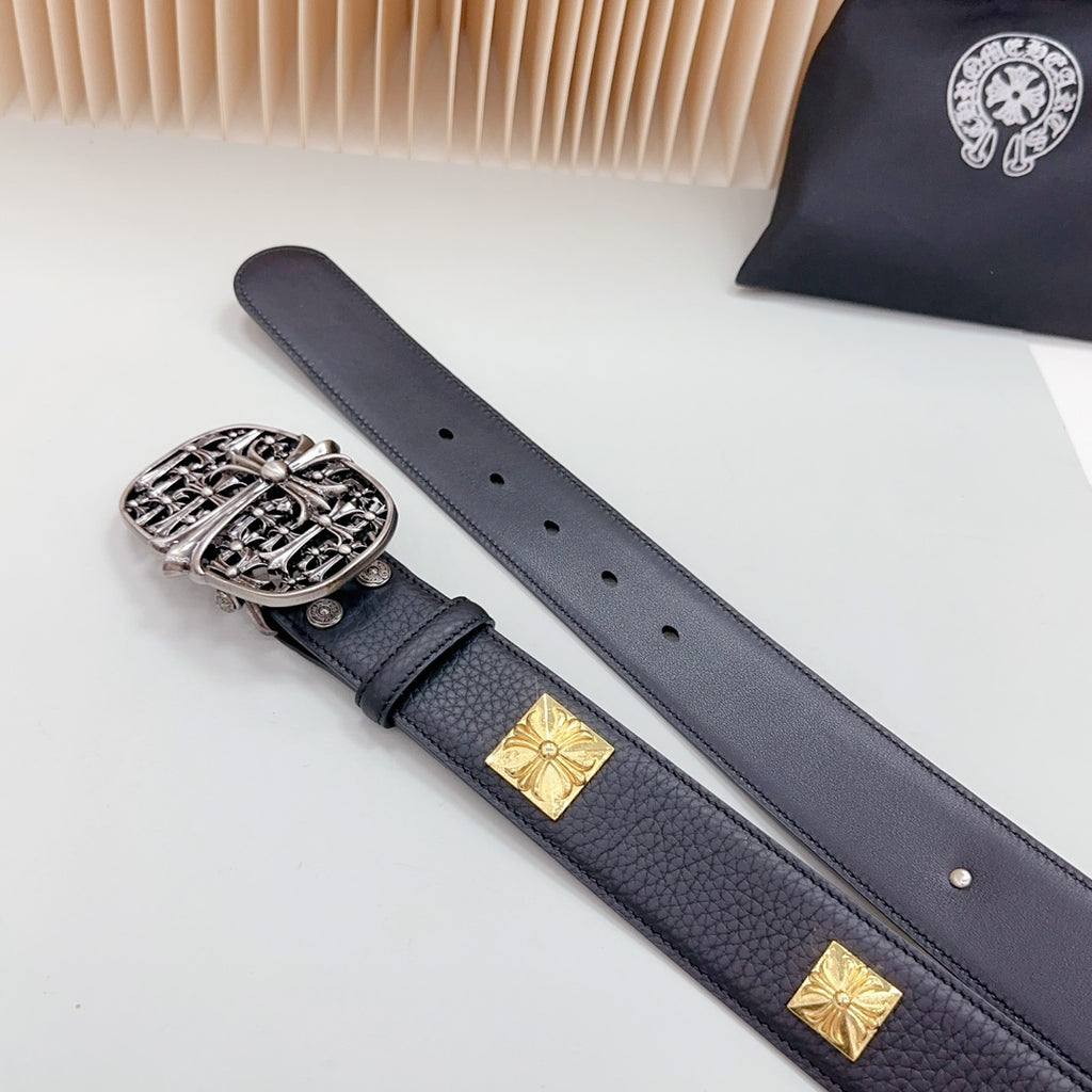 Leather belt with dark blue strap, gold studs, and ornate silver buckle