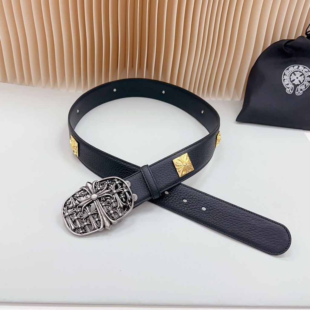 Leather belt with dark blue strap, gold studs, and ornate silver buckle with long tail