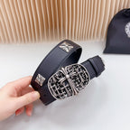 Navy leather belt detail with ornate silver buckle and cross-shaped plates